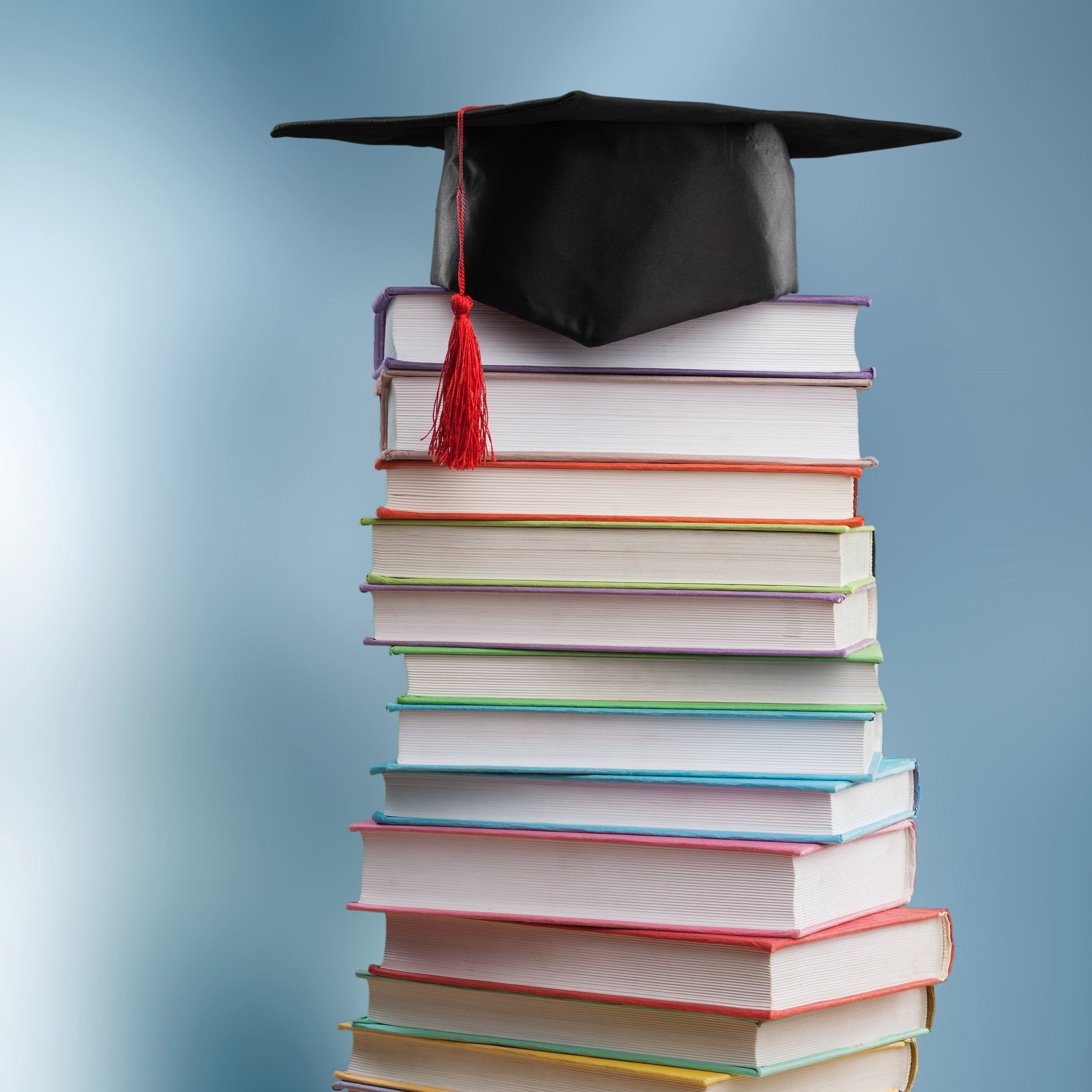Mortarboard and Books